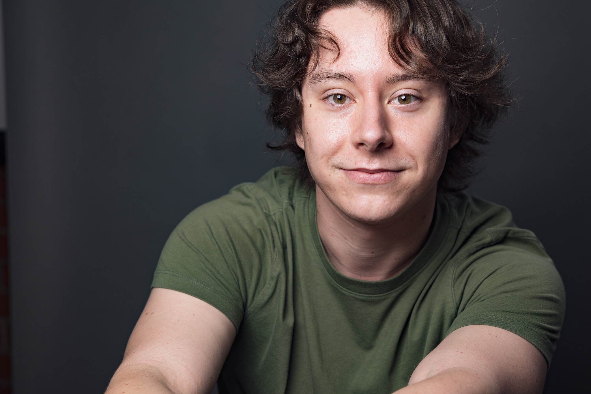 Finnegan Higginbotham serious headshot