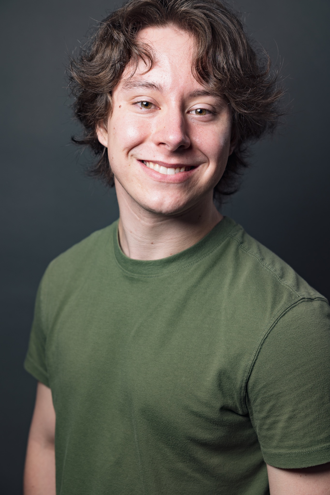 Finnegan Higginbotham smiling headshot